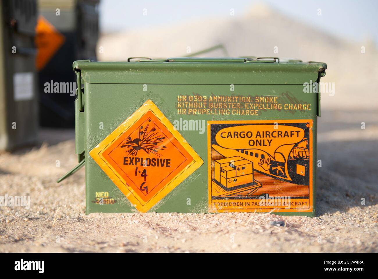 An explosive ordnance container sits in the sand at Ali Al Salem Air Base, Kuwait, July 4, 2021. EOD members are experts in chemical, biological, incendiary, radiological and nuclear materials and devices. The unit helps ensure freedom of operations in a deployed environment by applying special procedures to totally remove hazards created by unexploded ordnance and improvised explosive devices. Stock Photo