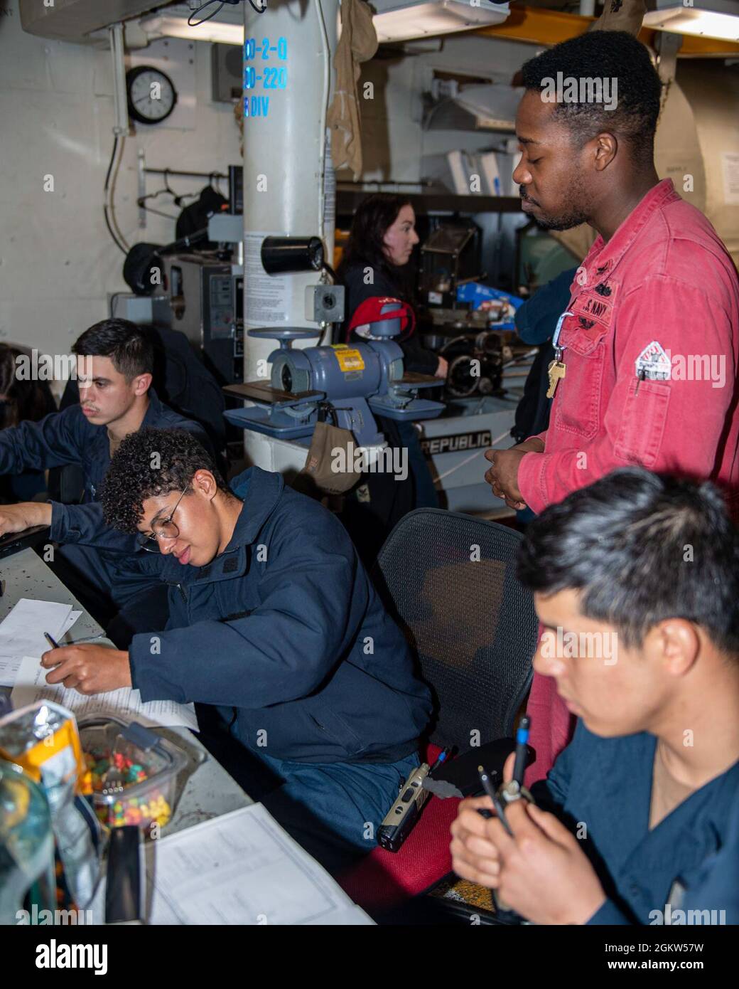 210705-N-HG846-2013 TASMA SEA (July 5, 2021) – Sailors take a damage control exam aboard Arleigh Burke-class guided-missile destroyer USS Rafael Peralta (DDG 115). Rafael Peralta is assigned to Commander, Task Force 71/Destroyer Squadron (DESRON) 15, the Navy's largest forward-deployed DESRON and U.S. 7th Fleet's principal surface force. Stock Photo