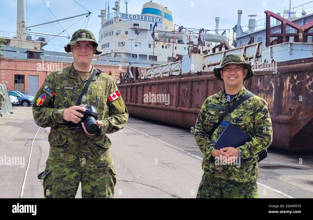 210706-F-D0094-233 ODESA, Ukraine (July 6, 2021) Canadian Armed Forces (CAF) Contingent's Public Affairs team, (left to right) Corporal Daniel Chiasson and Major Christopher Daniel, provide public affairs support for Exercise SEA BREEZE 21 in Odesa, Ukraine from June 28 to July 10, 2021. Co-hosted by the United States Navy Stock Photo