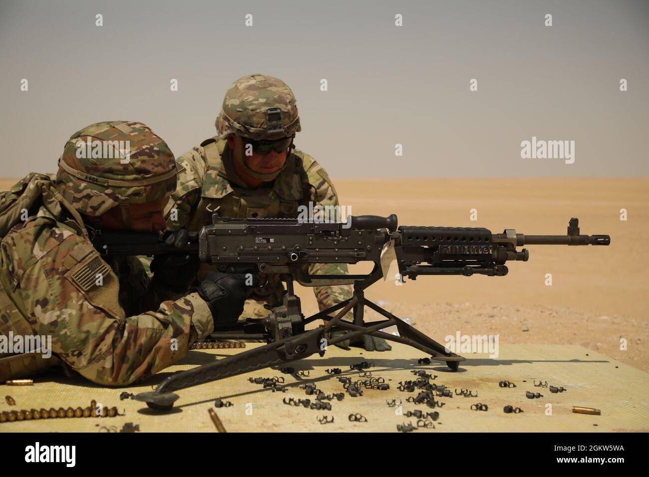 Pv2. Eduardo Vargas, a petroleum supply specialist with 247 Composite Supply Company, 393rd Combat Sustainment Battalion, attached to 3rd Division Sustainment Brigade, fires an M240B machine gun on Camp Buehring, Kuwait, June 6. The qualification was conducted to increase weapons readiness and lethality for future missions. Stock Photo