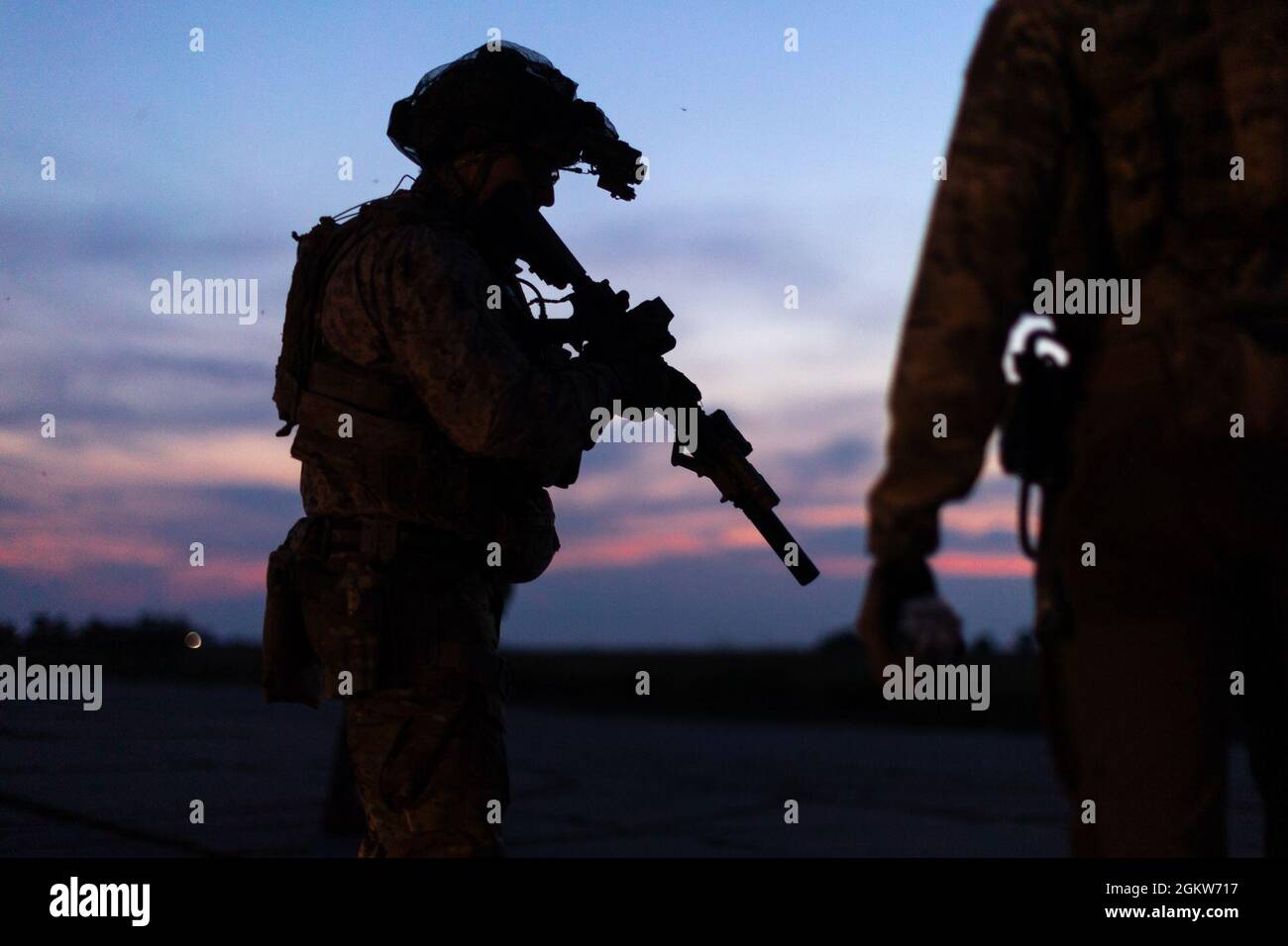 A U.S. Navy SEAL checks his weapon before a joint nighttime mission between Ukrainian Special Forces and U.S. Navy SEALs during exercise Sea Breeze 21, in Ochakiv, Ukraine, July 6 2021. Sea Breeze 21 is a U.S. and Ukraine co-hosted multinational maritime exercise held in the Black Sea designed to enhance interoperability of participating nations and strengthen maritime security within the region. Stock Photo