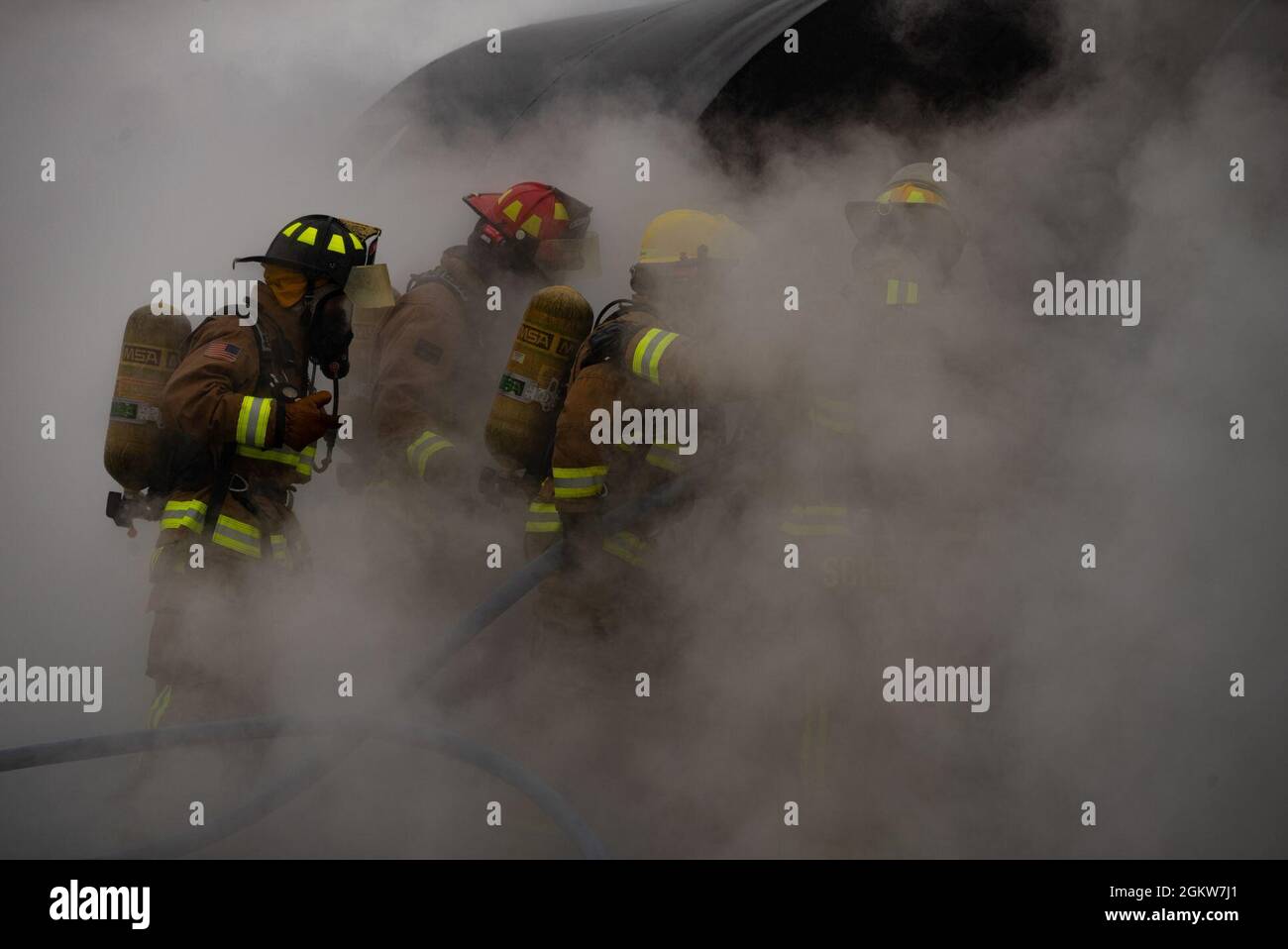 152nd Civil Engineer Squadron fire protection specialists walk through