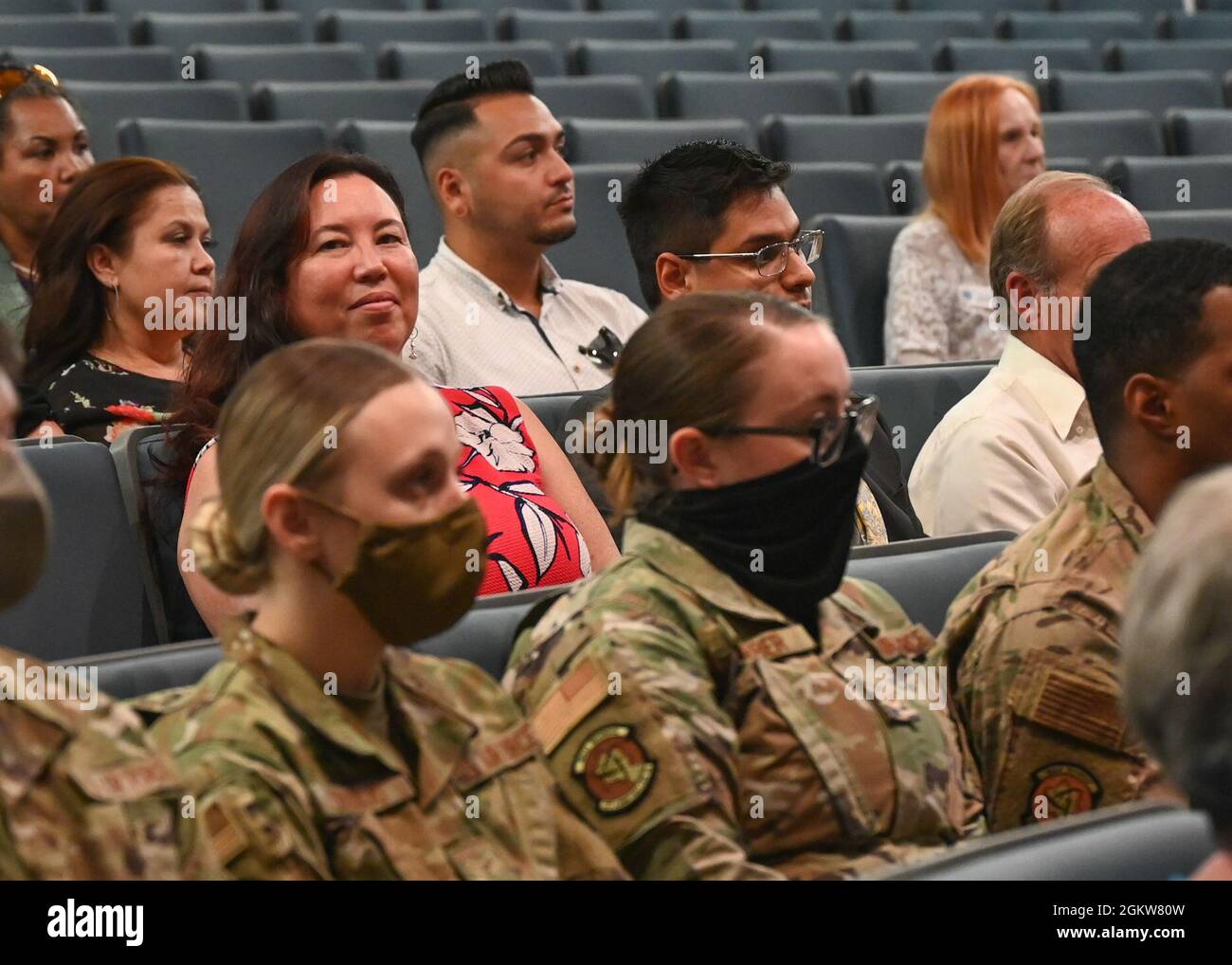 Members of Team Kirtland watch a change of command ceremony for the ...