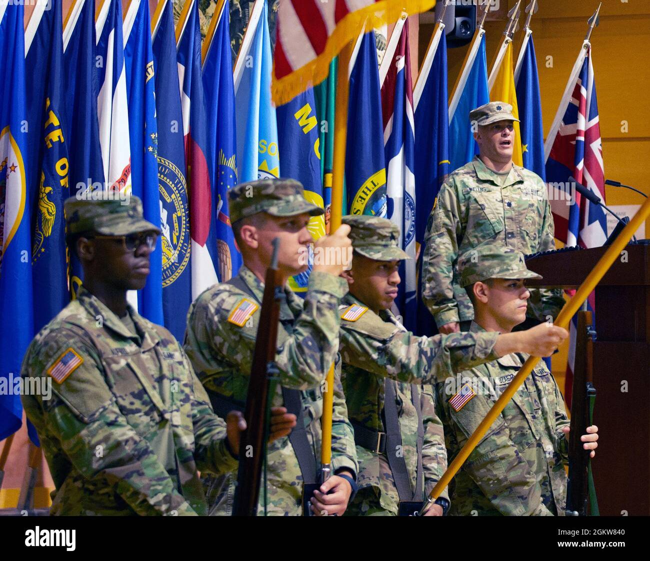 Lt. Col. Scott Willens sings the national anthem during a ...