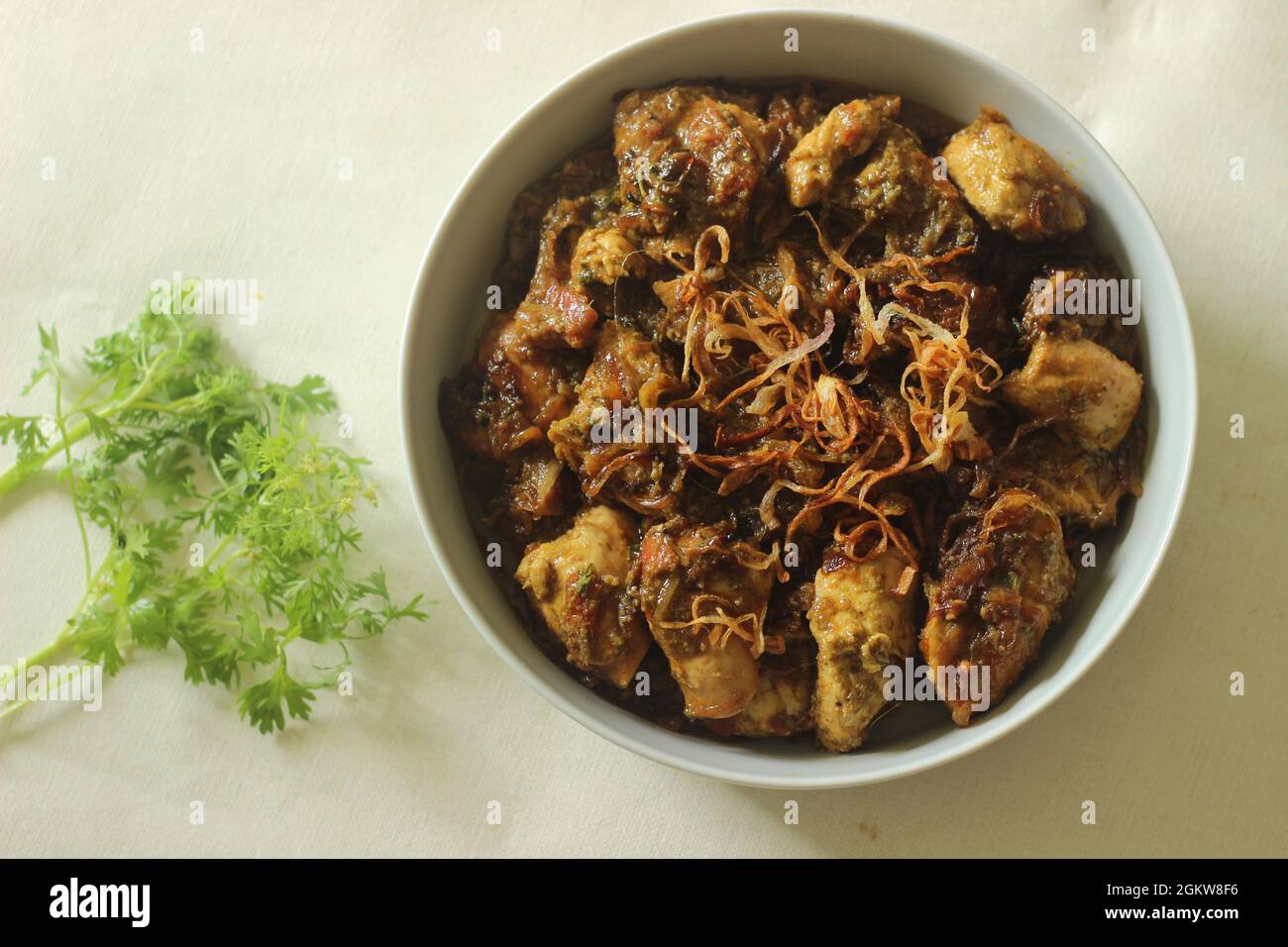 Ghee roast chicken prepared in Kerala style. Chicken marinated with
