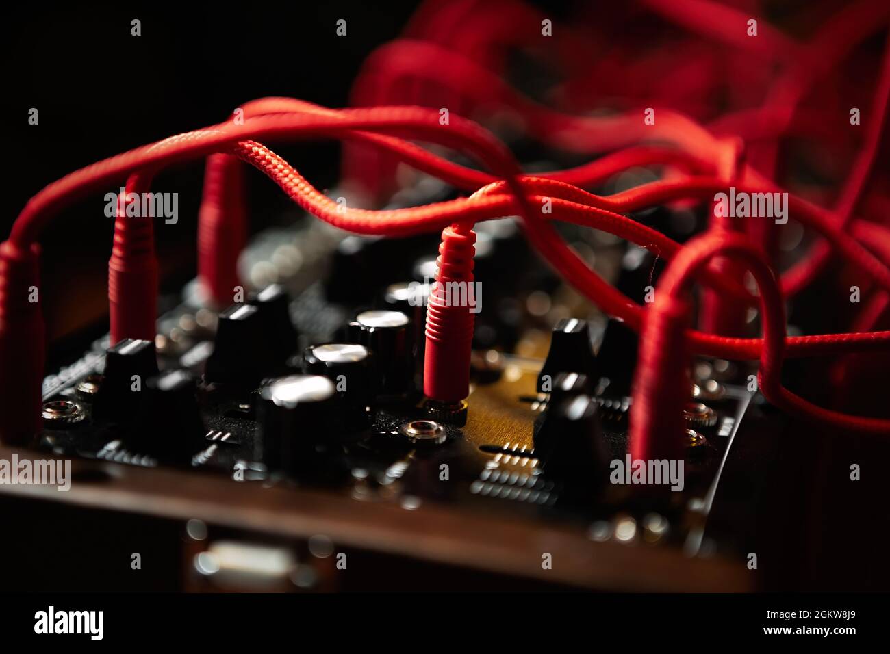Analog synthesizer with audio cables. Professional modular synth device for electronic music production in sound recording studio Stock Photo