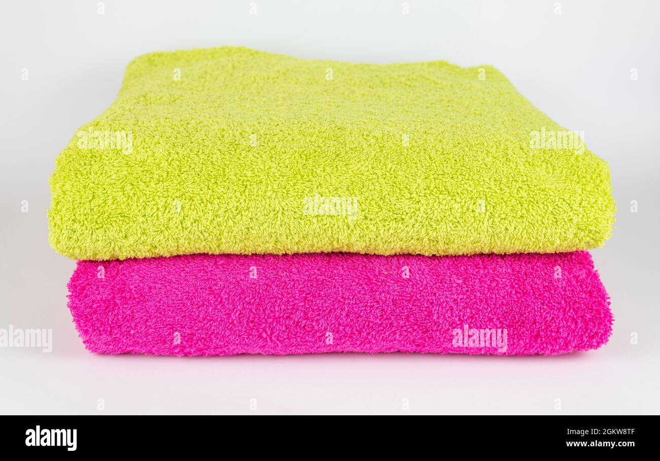 Light green and pink towel on white background Stock Photo