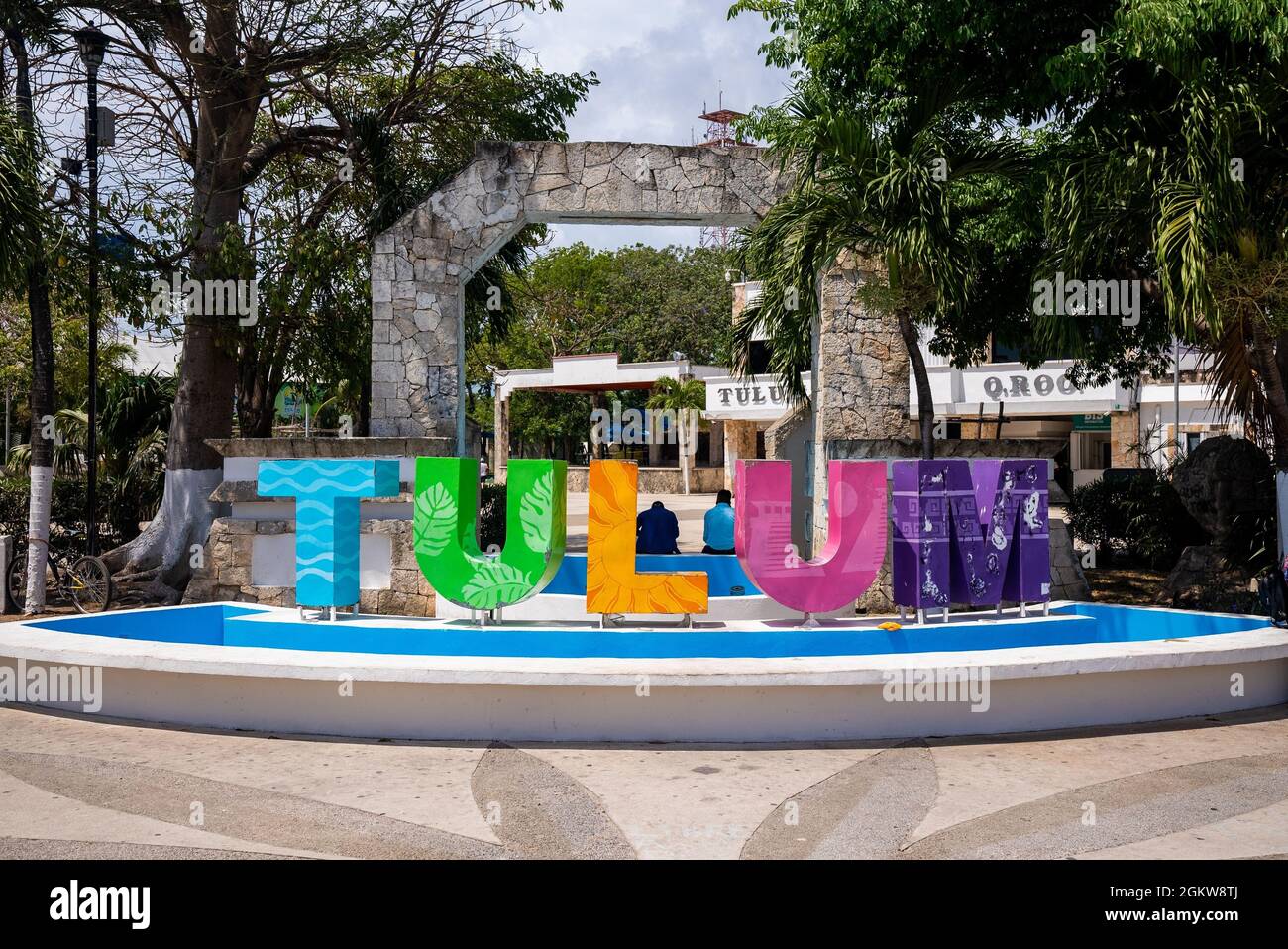 Multi colored Tulum text sign in the city on a bright sunny day Stock