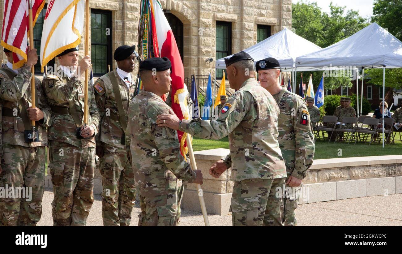 Commanding General, Gen. Michael X. Garrett, hands the First