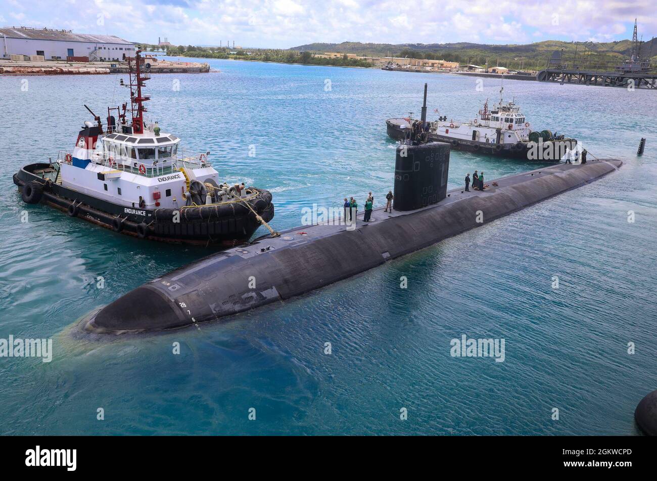 210708-N-XP344-2013 APRA HARBOR, Guam (July 8, 2021) The Los Angeles-class fast-attack submarine USS Springfield (SSN 761) depart Naval Base Guam after completing a regularly scheduled evolution with the submarine tender USS Emory S. Land (AS 39). Springfield is capable of supporting various missions, including anti-submarine warfare, anti-surface ship warfare, strike warfare and intelligence, surveillance and reconnaissance. Stock Photo