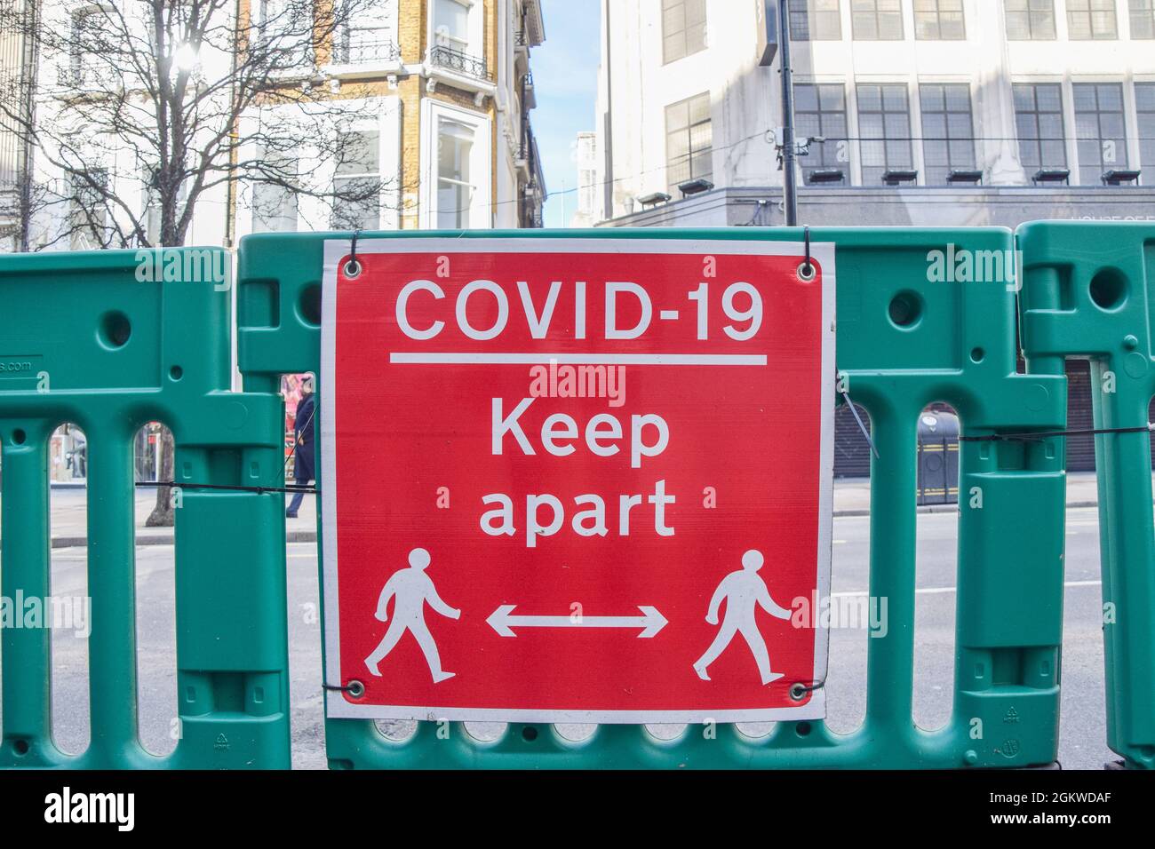 'COVID-19 Keep Apart' sign on Oxford Street during the coronavirus pandemic. London, United Kingdom 10 February 2021. Stock Photo