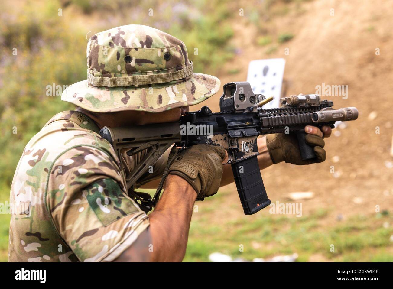 A U.S. Navy SEAL fires a MK18 rifle at a range during exercise Sea Breeze 21 in Ochakiv, Ukraine, July 8, 2021. Sea Breeze 21 is a U.S. and Ukraine co-hosted multinational maritime exercise held in the Black Sea designed to enhance interoperability of participating nations and strengthen maritime security within the region. Stock Photo