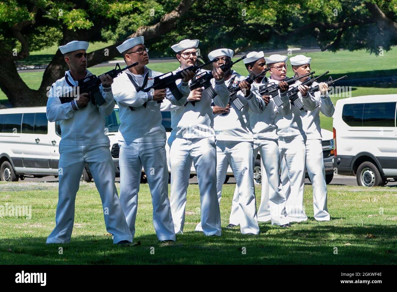 Sailors assigned to U.S. Navy Region Hawaii conduct a funeral for U.S. Navy Musician 2nd Class Charlton Hanna Ferguson, 19, of Kosciusko, Missouri at the National Memorial Cemetery of the Pacific, Honolulu, Hawaii, July 9, 2021. Ferguson was assigned to the USS Oklahoma when it sustained fire from Japanese aircraft and multiple torpedo hits. The result of the attack capsized the battleship causing the deaths of 429 crew members on Dec. 7, 1941, at Ford Island, Pearl Harbor. Ferguson was identified Dec. 17, 2020 through DNA analysis by the Defense POW/MIA Accounting Agency (DPAA) forensic labor Stock Photo