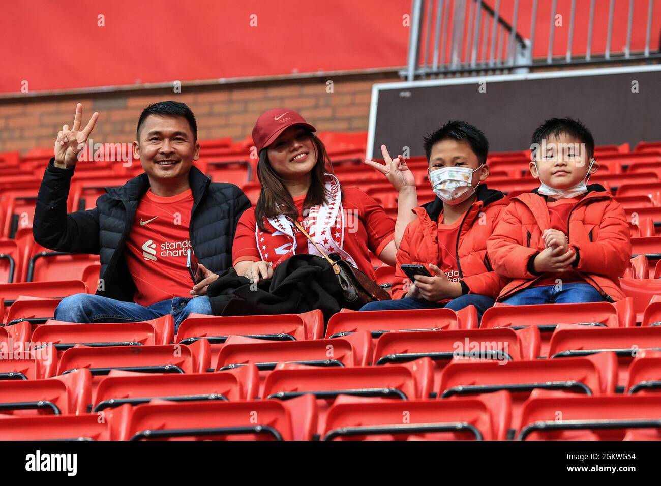 Liverpool, UK. 15th Sep, 2021. A family take to their seats as the gates of Anfield open for this evenings UEFA Champions League game, Liverpool v AC Milan in Liverpool, United Kingdom on 9/15/2021. (Photo by Mark Cosgrove/News Images/Sipa USA) Credit: Sipa USA/Alamy Live News Stock Photo
