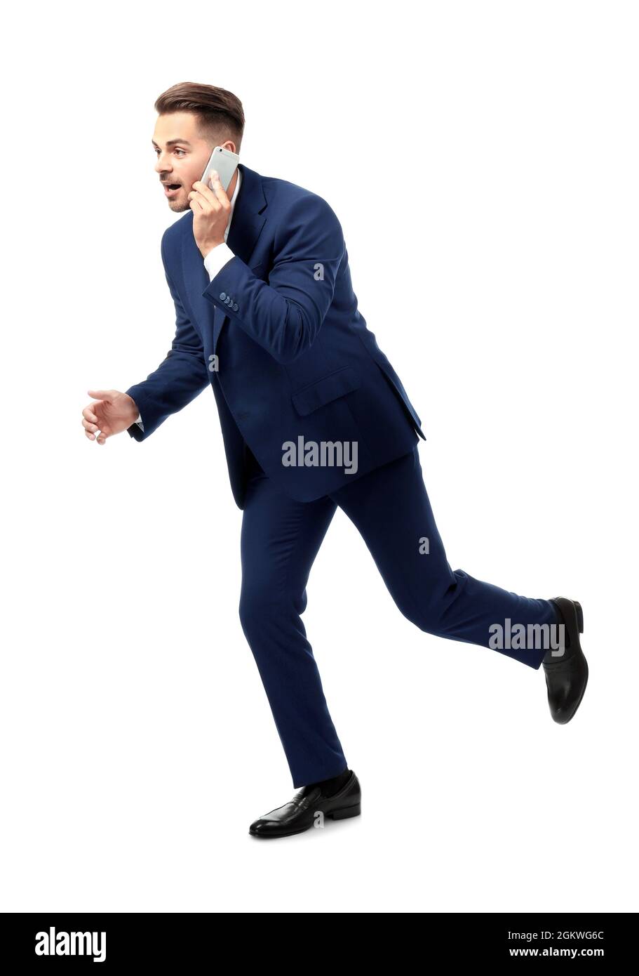 Handsome running businessman on white background Stock Photo - Alamy