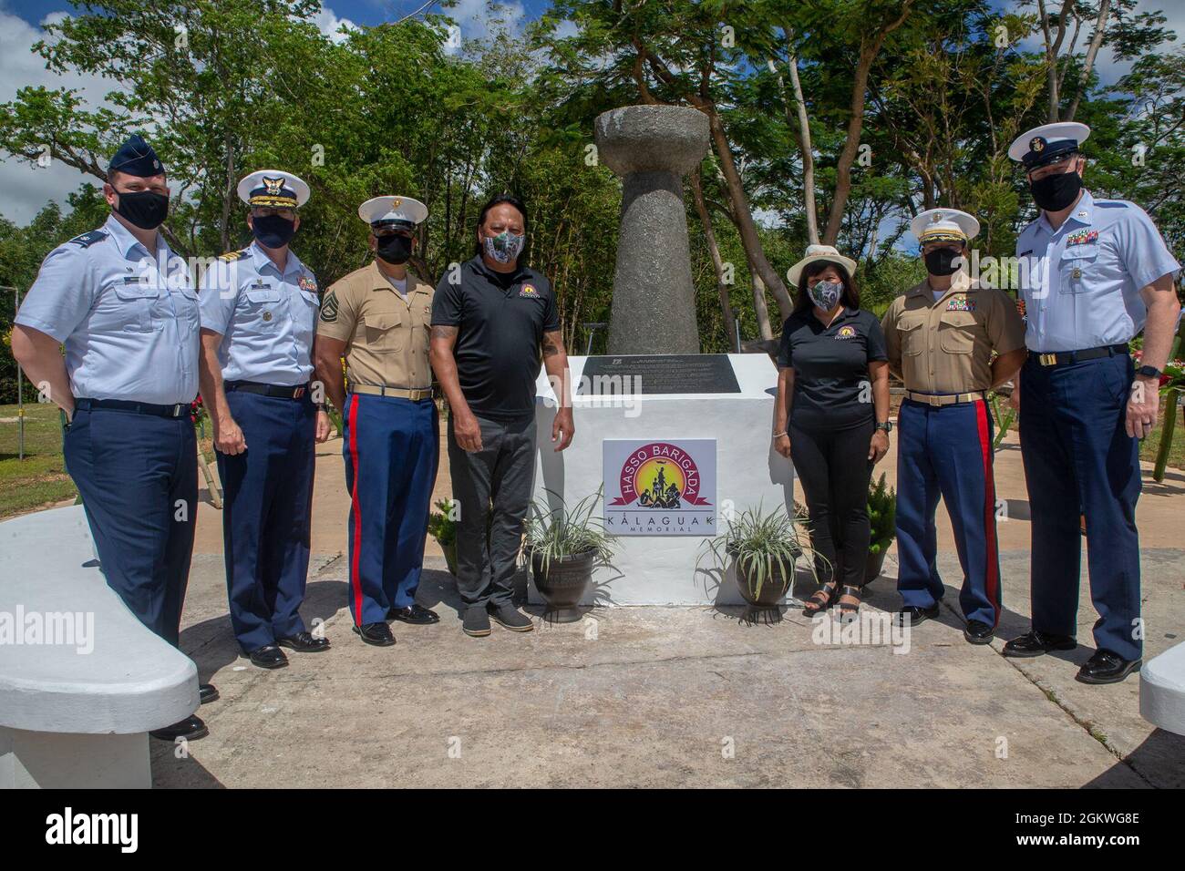 Marine Corps Base (MCB) Camp Blaz senior leaders pose for a photograph with other senior military leaders and the mayor and vice mayor of Barrigada, Guam in front of the Kǻlaguak memorial, July 9, 2021. The Kǻlaguak memorial is located at the site of a former Japanese military airfield. The memorial service was among the many held across the island to commemorate the liberation of Guam during World War II in 1944. Stock Photo