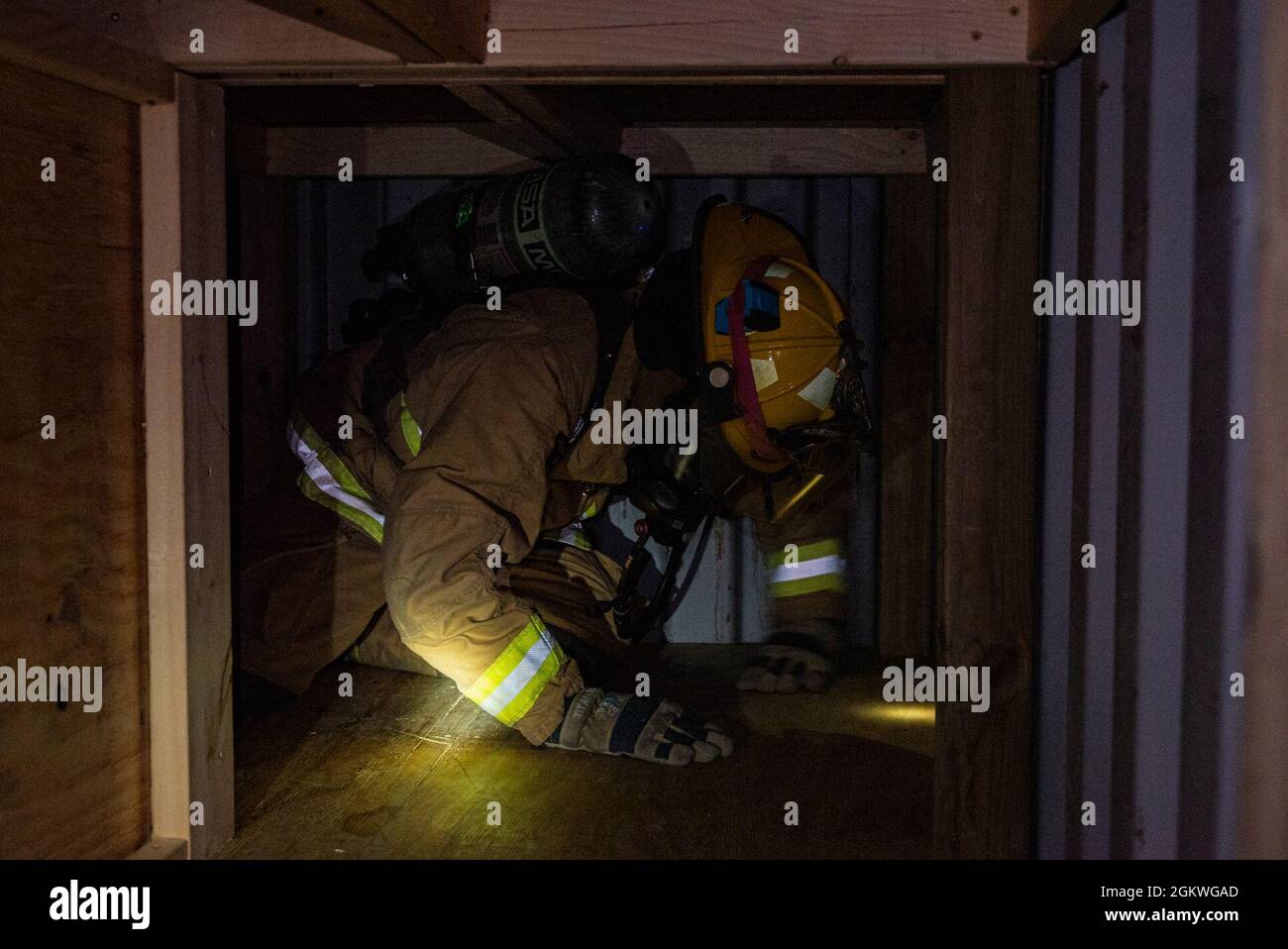 A 152nd Civil Engineer Squadron fire protection specialist maneuvers