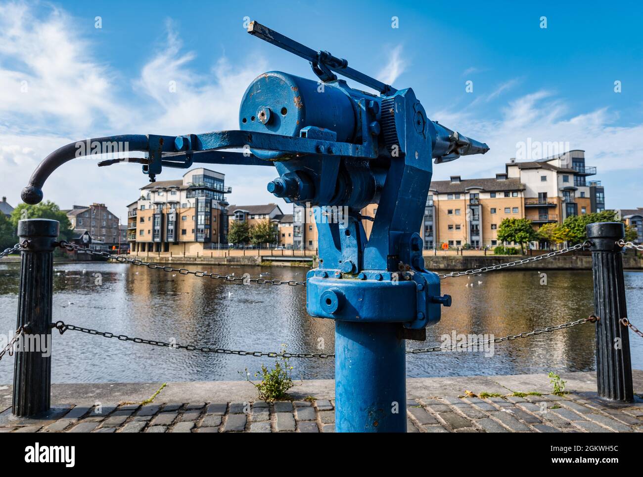 Harpoon gun whaling industry relic on riverside on a sunny day with blue sky, The Shore, Water of Leith, Edinburgh, Scotland, UK Stock Photo
