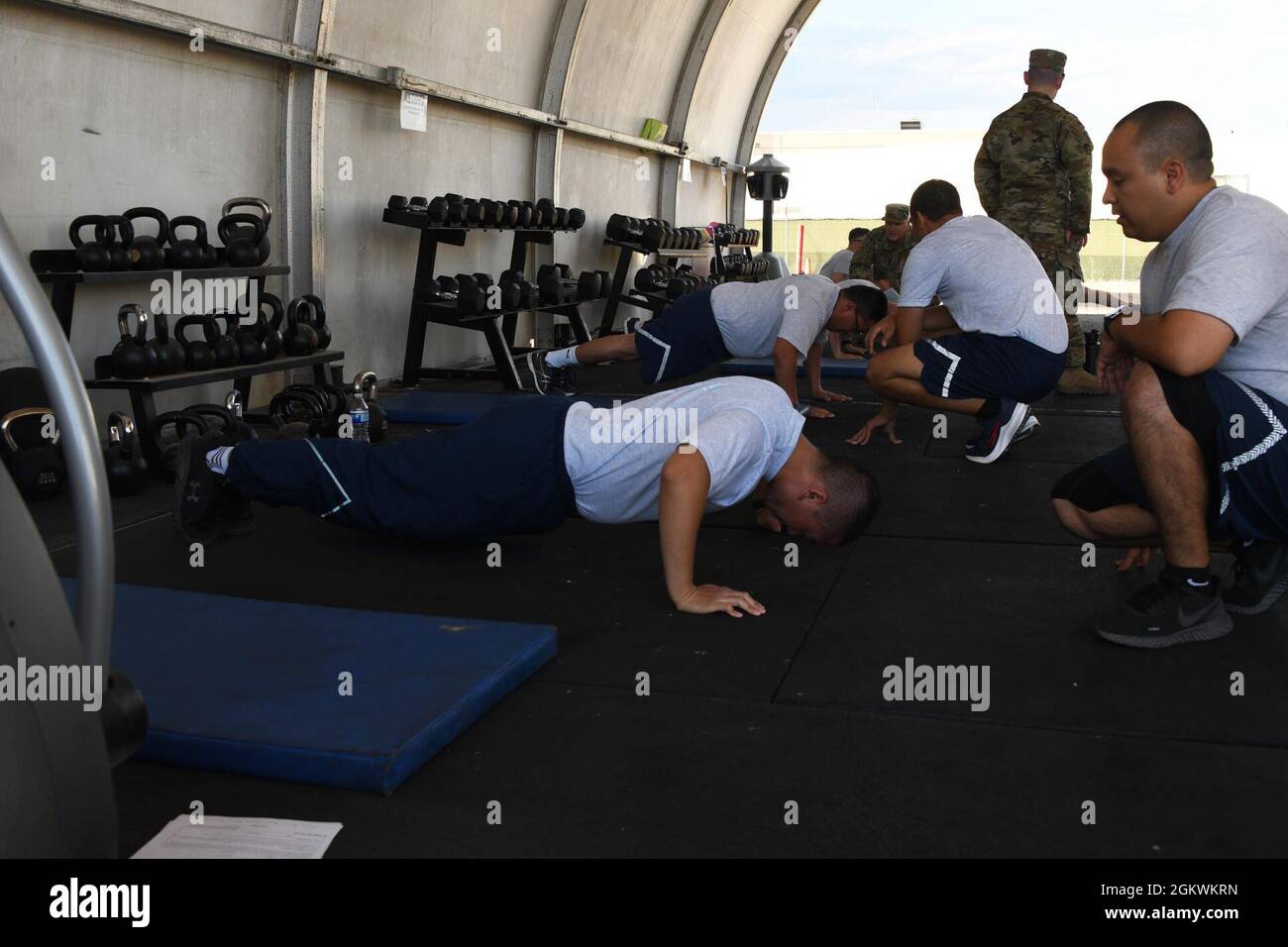 U.S. Air Force Airmen at the 144th Fighter Wing complete the push-ups  portion of the Air Force physical fitness test July 11, 2021, at the Fresno  Air National Guard Base, Calif. Components