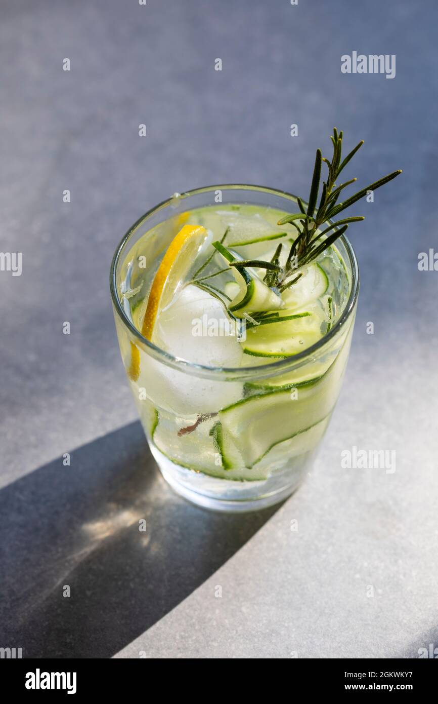 Gin and tonic with cucumber, juniper berries and rosemary Stock Photo Alamy