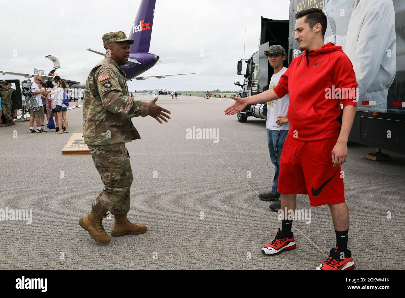 Sgt. 1st Class Seth T. Charlton, a recruiter with the U.S. Army Recruiting Station in Dayton, Ohio, introduces himself to civilians during the 2021 Centerpoint Energy Dayton Air Show July 11 at the Dayton International Airport. The 46th annual event, headlined by the U.S. Air Force Thunderbirds and U.S. Army Golden Knights, allowed civilians to interact with service members and support Dayton’s biggest celebration of aviation. Stock Photo