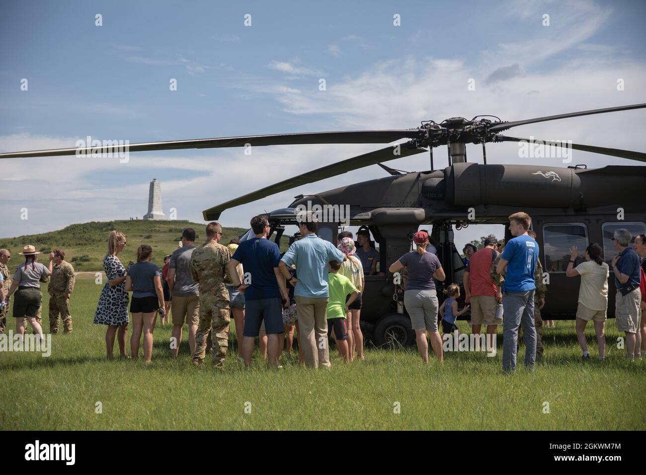 Soldiers of the Kentucky Army National Guard were welcomed by guests at the Wright Brothers National Memorial at Kitty Hawk, NC on July 11, 2021.  Pilots and crew of Bravo Company, 2/147th Assault Helicopter Battalion (AHB), based out of Boone National Guard Center in Frankfort, KY, landed four UH-60 Black Hawk helicopters on the same landing strip of Orville and Wilbur Wright’s first airplane flight of 1903.  This image was electronically cropped and ethically enhanced to emphasize the subject and does not misrepresent the subject or the original image in any way Stock Photo
