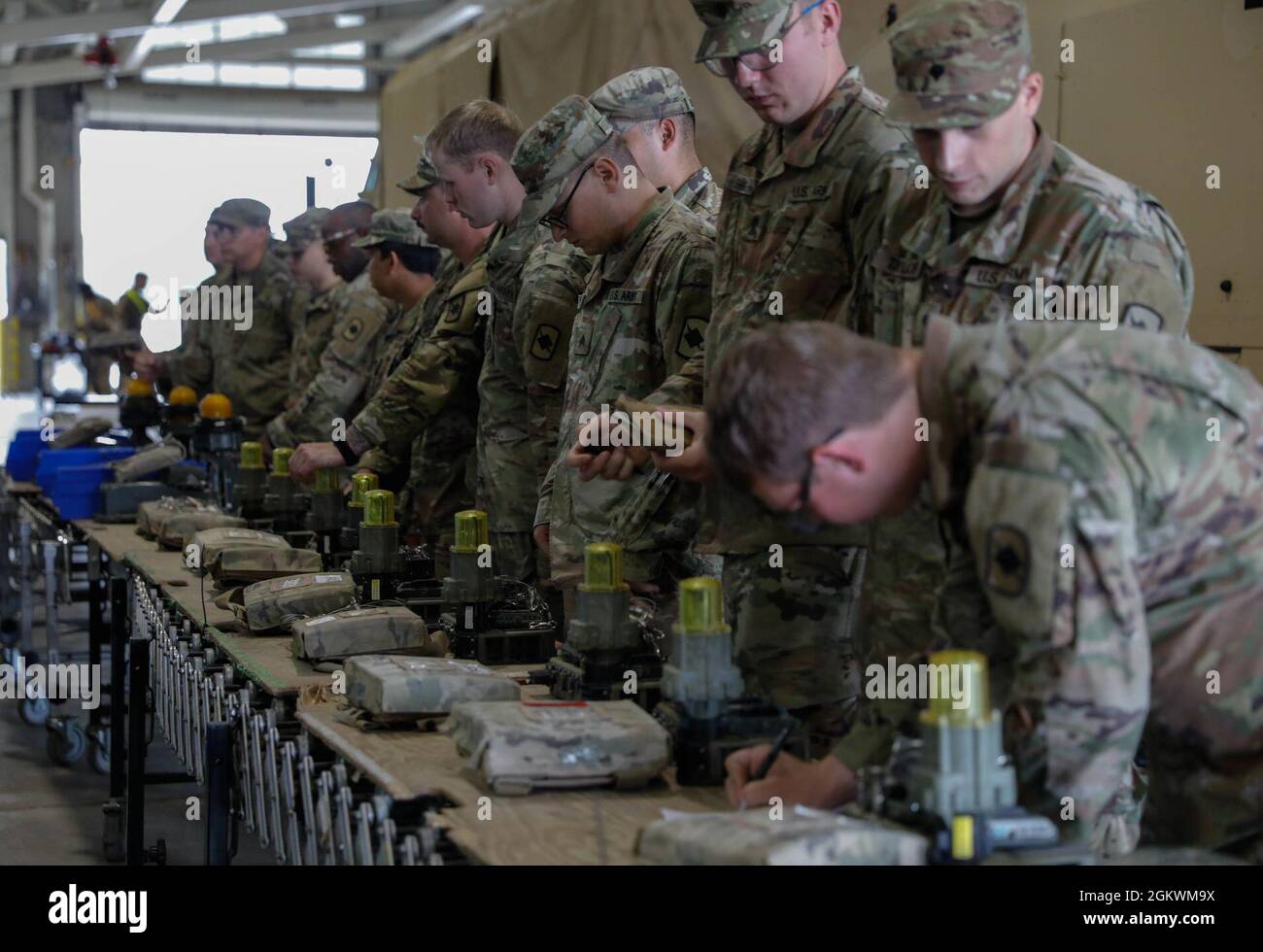 U.S. Army National Guard Soldiers assigned to both Delta Company, 2nd Battalion, 153rd Infantry Regiment as well as Delta Company, 39th Brigade Support Battalion, Arkansas Army National Guard, receive multiple integrated laser engagement system (MILES) gear to be affixed to their tactical vehicles at Fort Polk, La. July 11, 2021. Stock Photo