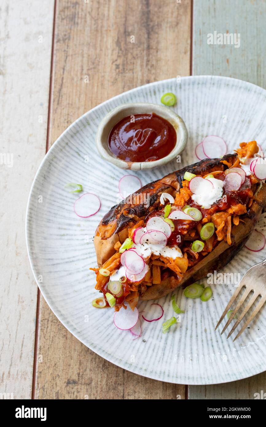 Baked sweet potato with barbeque jackfruit Stock Photo Alamy