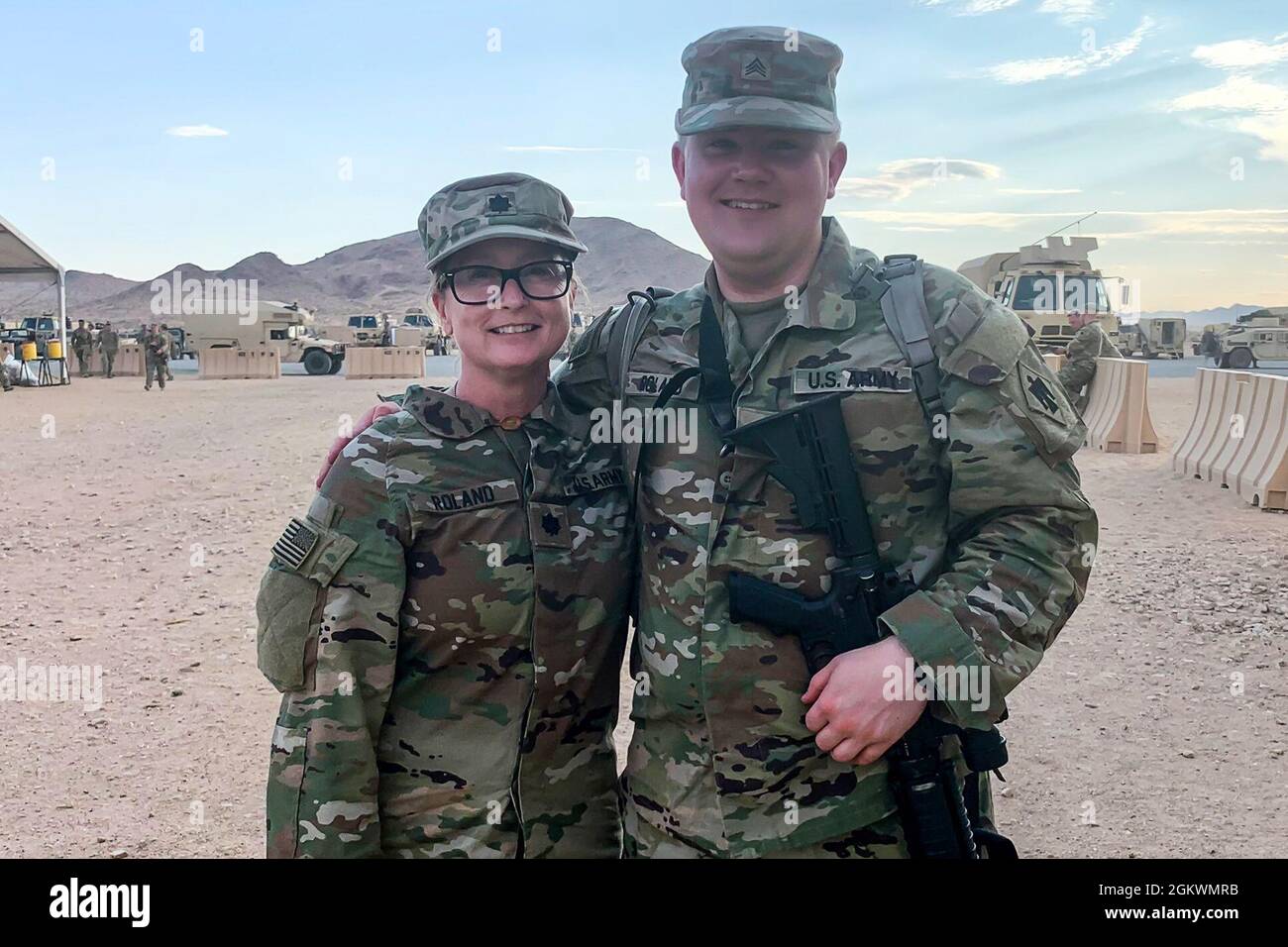 Lt. Col. Tanya Roland and her son, Sgt. Paul Roland, serve together in the 45th IBCT during a rotation at the National Training Center in Fort Irwin, CA, July 11, 2021. Tanya Roland, the 45th IBCT judge advocate, transferred to the Oklahoma Army National Guard in November 2020 after nearly 18 years of service with the United States Army Reserve. Paul Roland, religious affairs specialist for Headquarters Battery, 1st Battalion, 160th Field Artillery Regiment, has been in the Oklahoma Army National Guard for seven years. Stock Photo