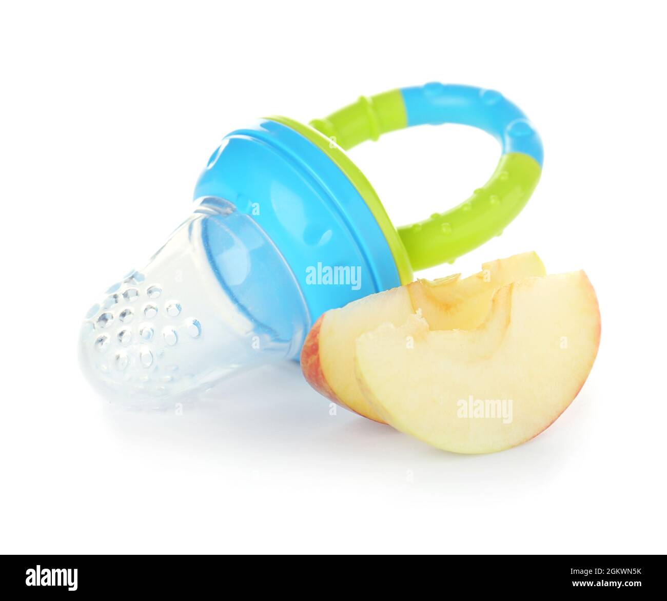 Baby's nibbler and ripe apple on white background Stock Photo Alamy