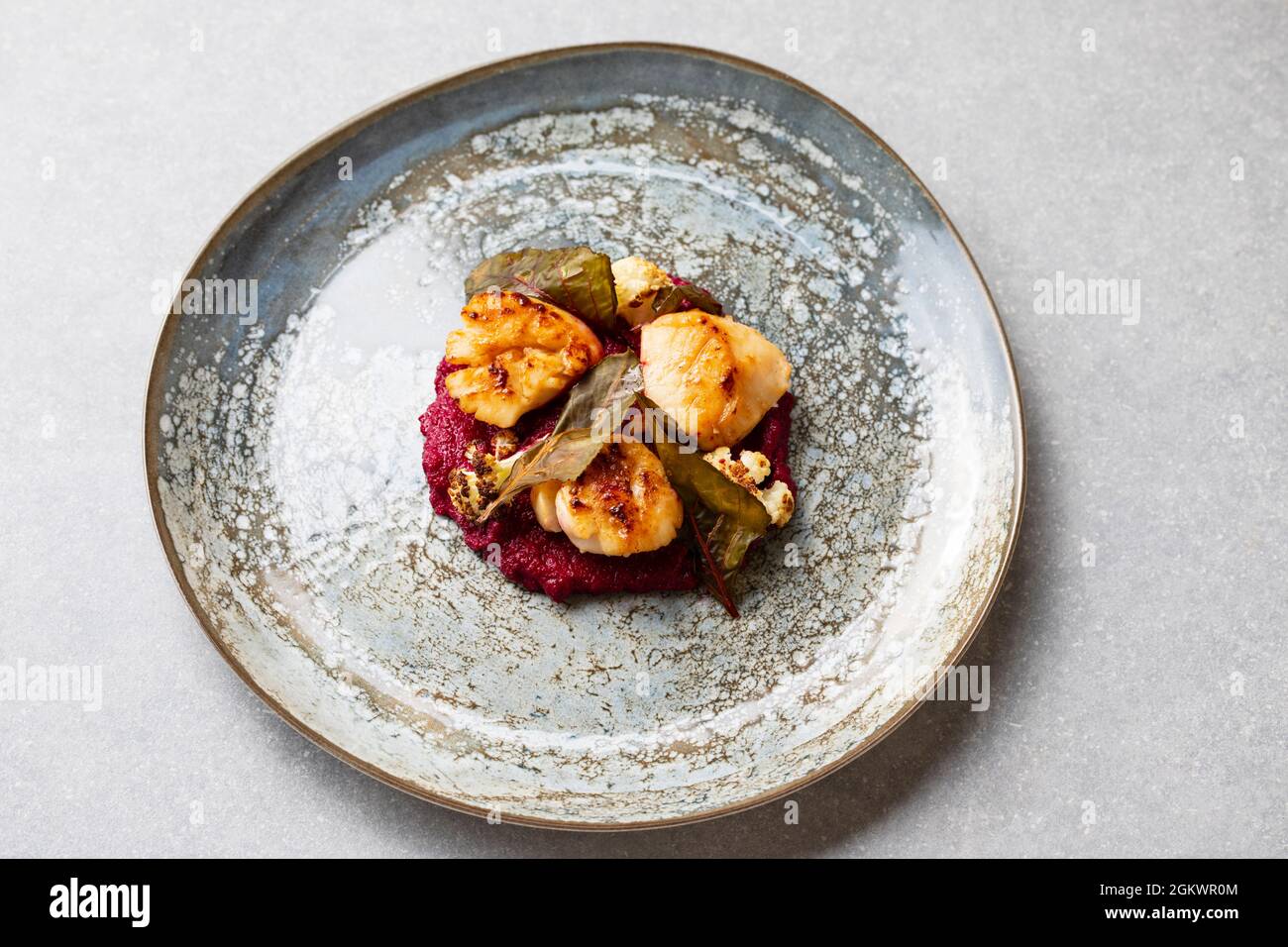 Pan fried scallops with beetroot puree and cauliflower Stock Photo Alamy
