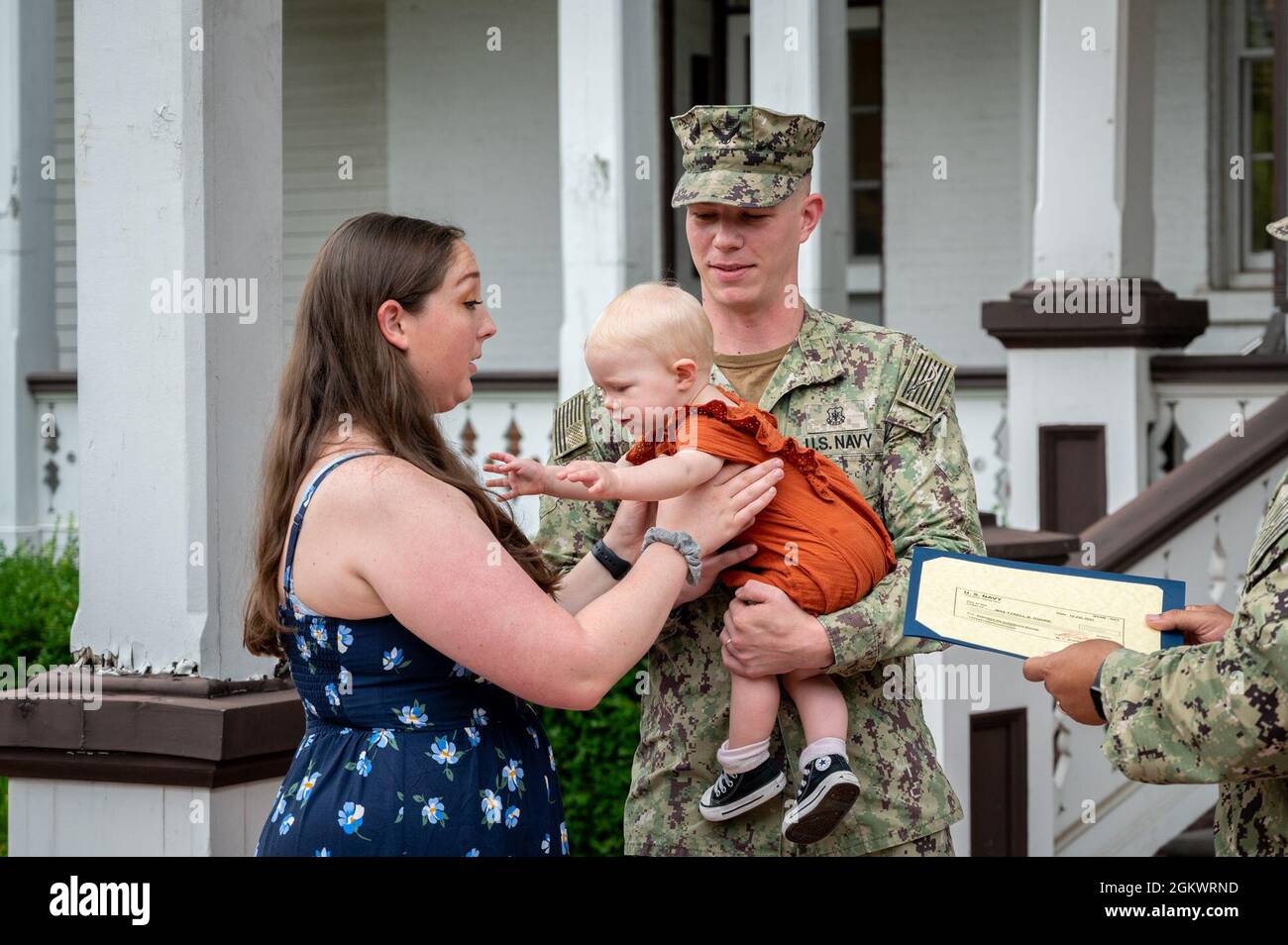 WASHINGTON, DC (July 12, 2021) – Family members of Master-at-Arms 2nd Class Tyrell Dugre, right, attend his reenlistment ceremony onboard Washington Navy Yard. Stock Photo