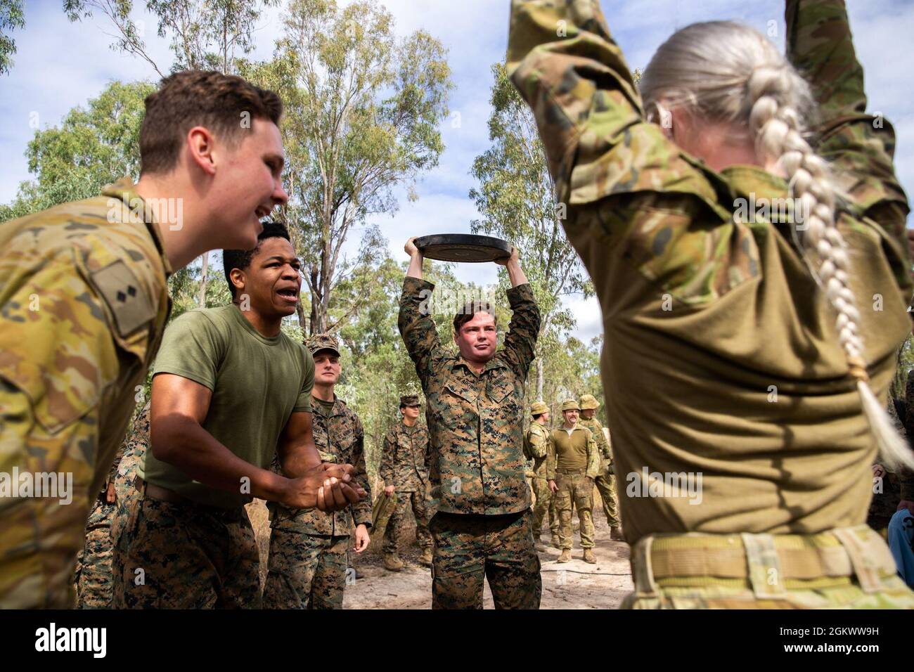 U.S. Marines with 3d Battalion, 12th Marines, 3d Marine Division and Australian Defence Forces with 7th Combat Service Support Battalion, compete in a fitness competition during Talisman Sabre 2021 at Camp Growl, Shoalwater Bay Training Area, Queensland, Australia,  July 13, 2021. This is the ninth iteration of Talisman Sabre, a large-scale, bilateral military exercise between Australia and the U.S. involving more than 17,000 participants from seven nations. The month-long multi-domain exercise consists of a series of training events that reinforce the strong U.S./Australian alliance and demon Stock Photo