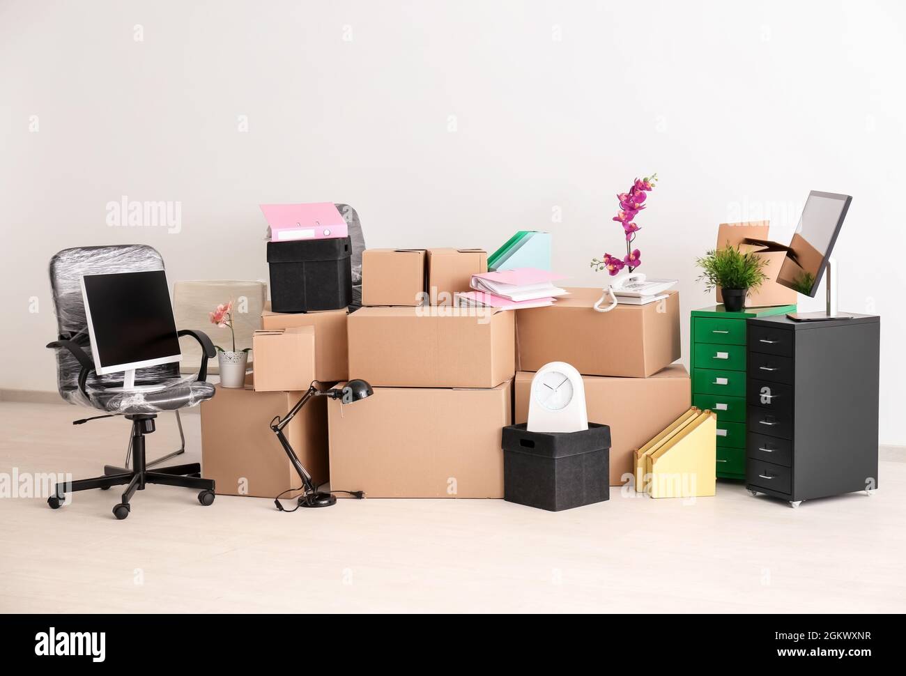 Moving boxes and different stuff in new office Stock Photo - Alamy