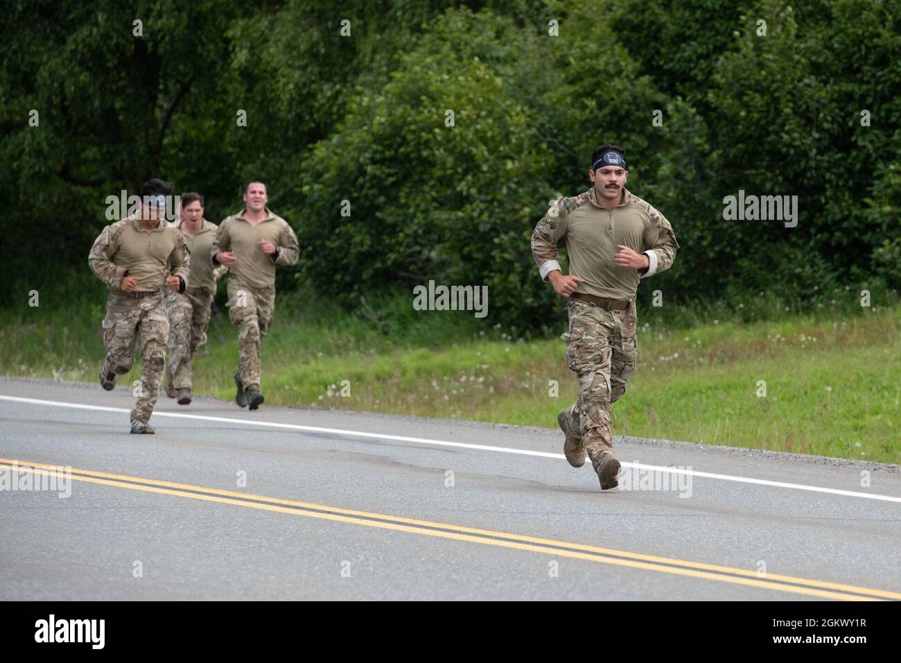 U.S. Air Force tactical air control party specialists compete in a timed  run during the Chaos Challenge 2021 at Joint Base Elmendorf-Richardson,  Alaska, July 13, 2021. The Chaos Challenge 2021 was a
