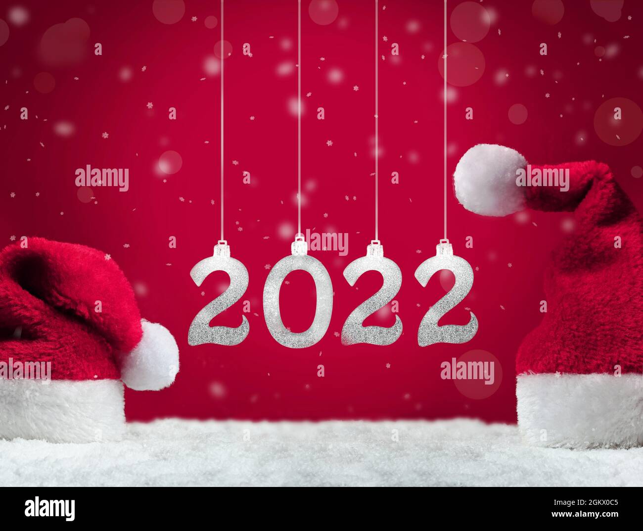 Christmas Eve 2022 For Two Two Santa Hats On Snow On Red Background, Christmas Decoration. Holiday  Concept. 2022 Stock Photo - Alamy