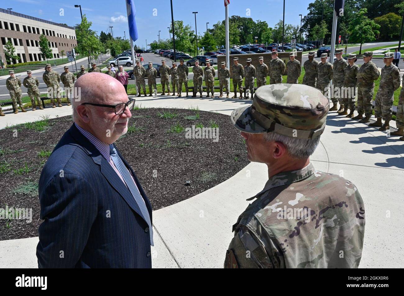 Acting Secretary of the Air Force John P. Roth speaks with Col. Jason ...