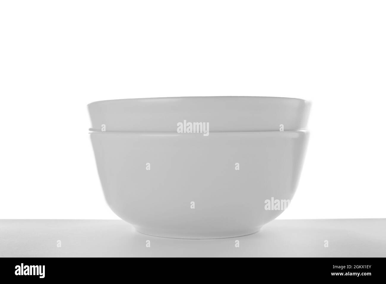 Ceramic bowls on white background Stock Photo - Alamy