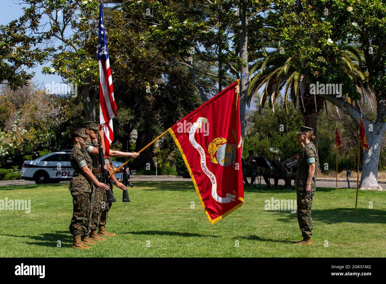 U.S. Marine Lt. Col. Andrea Gulliksen, the commander of troops, salutes the colors during a change of command ceremony for Security and Emergency Services Battalion, Marine Corps Base Camp Pendleton, at the Santa Margarita Ranch House on Camp Pendleton, California, July 14, 2021. During the ceremony, Col. Edward Greeley, the outgoing commanding officer of SES Bn., relinquished command to Col. John Black. Greeley had been the commander of SES Bn. since July 2019. Stock Photo
