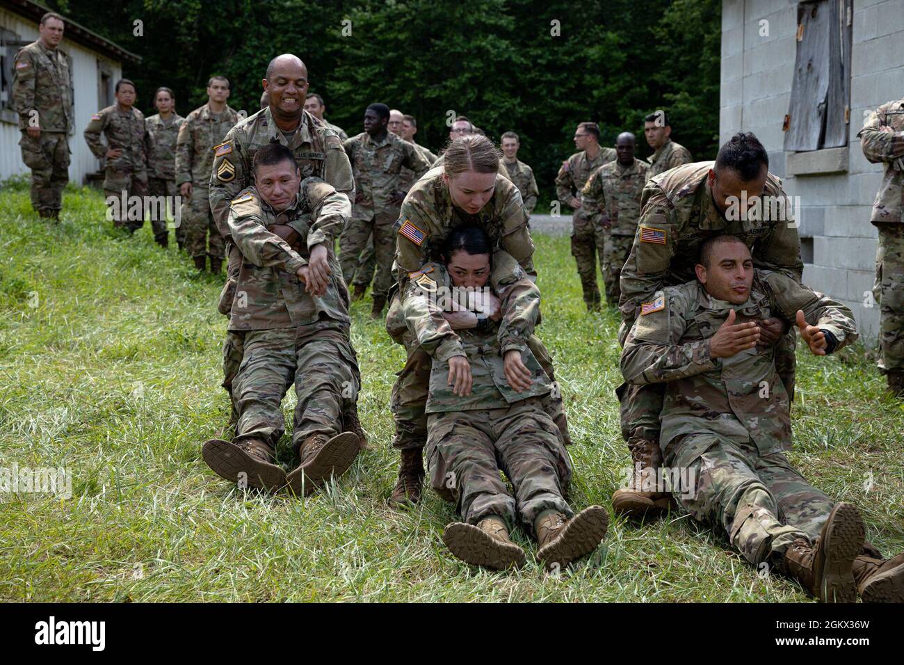 Officer Candidates drag simulated casualties utilizing the cradle drop