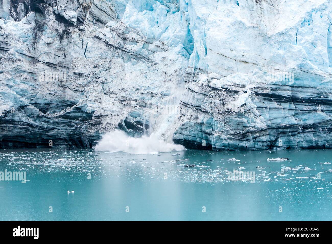 Ice calving on the Margerie Glacier terminus into the waters of the Tarr Inlet, Glacier Bay National Park, Alaska Stock Photo