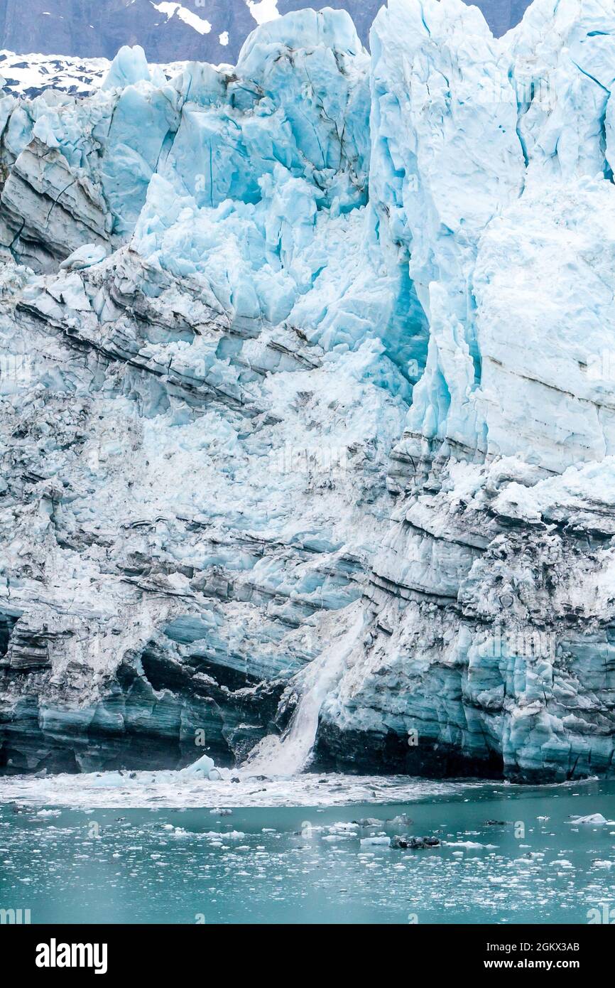 Ice calving on the Margerie Glacier terminus into the waters of the Tarr Inlet, Glacier Bay National Park, Alaska Stock Photo
