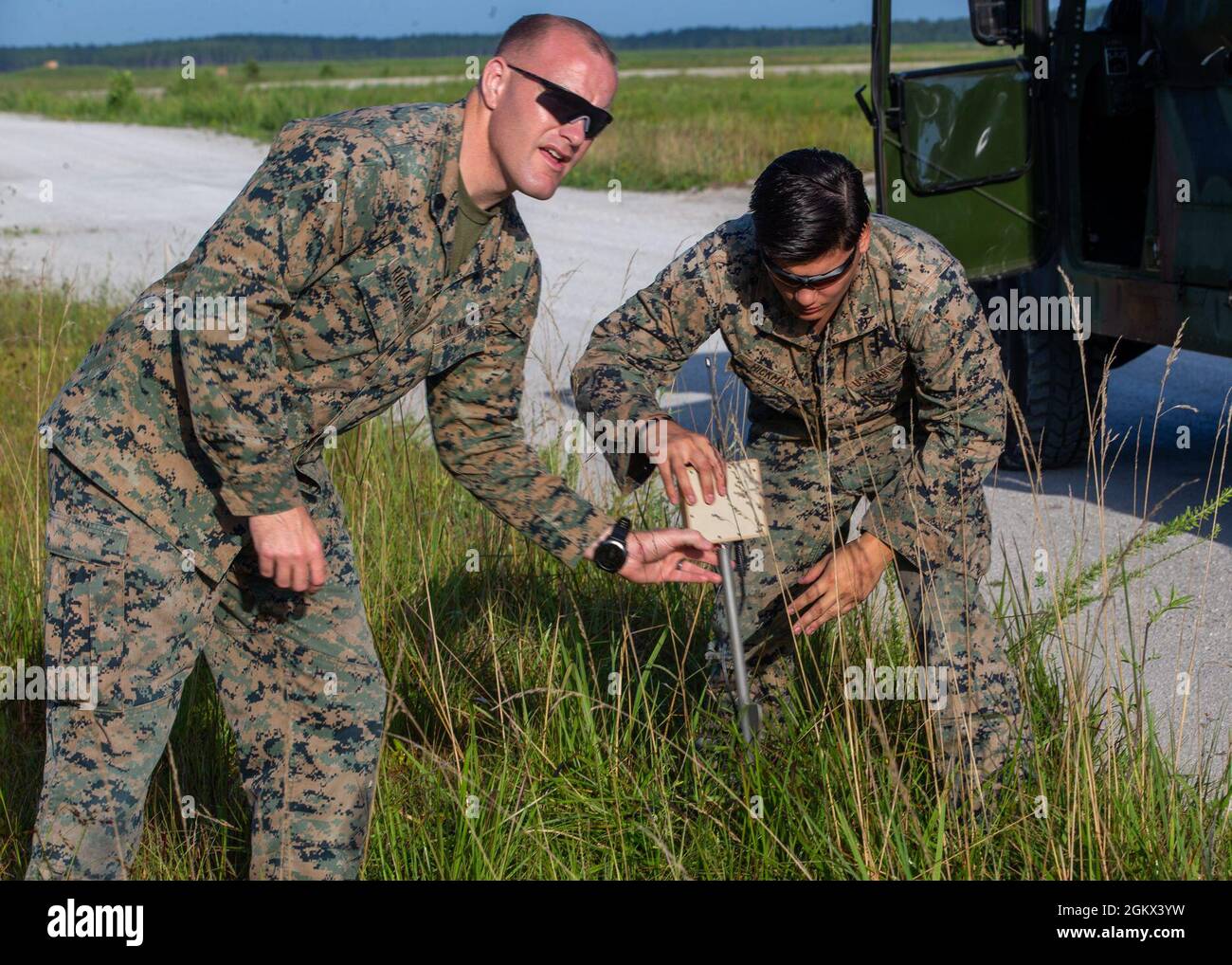 U.S. Marine Corps Gunnery Sgt. Christopher Rickards, left, and Lance
