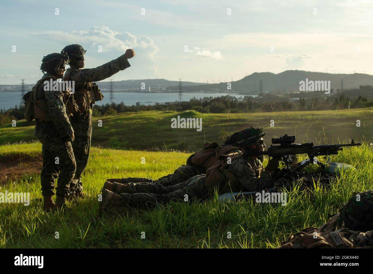 U.S. Marines with 2d Battalion, 3d Marines, conduct a live-fire squad attack on Camp Hansen, Okinawa, Japan, July 15, 2021. Marines rehearsed combined arms tactics in maritime terrain and sustained individual and small unit proficiency. 2/3 is forward-deployed in the Indo-Pacific under 4th Marines, 3d Marine Division as part of the Unit Deployment Program. Stock Photo