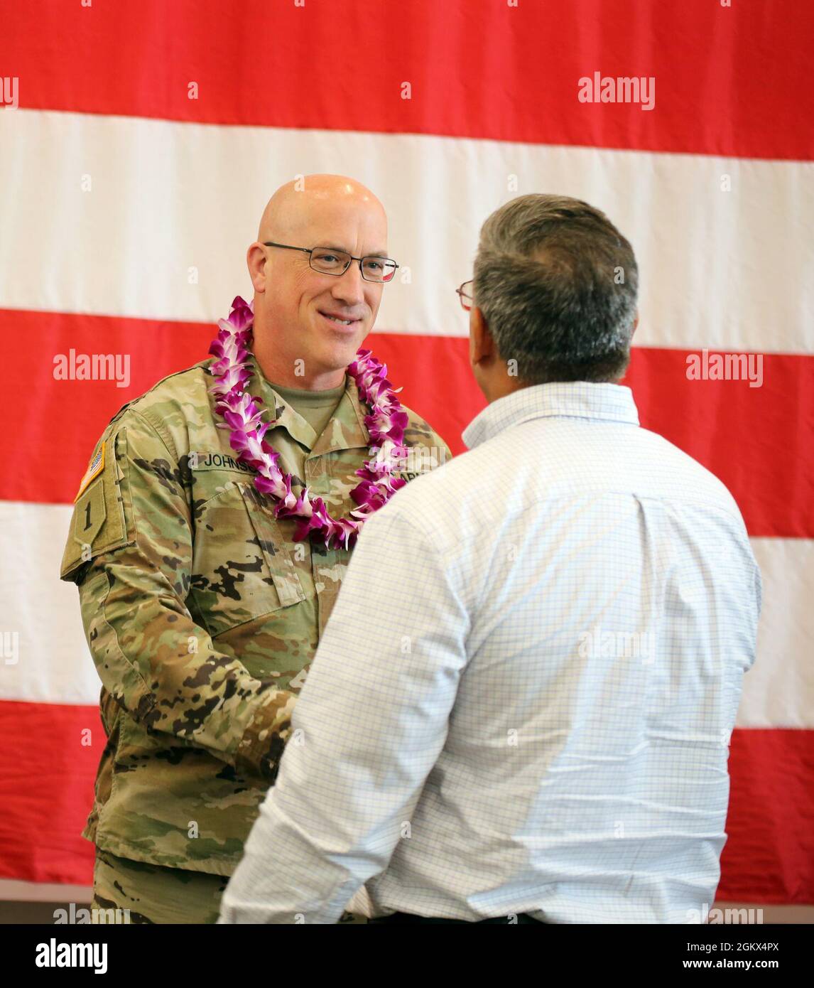 Chief Warrant Officer Five Jim Johnson shakes hands with Col. (Ret.) Anthony Lieggi during a Joint Chief Warrant Officer Five promotion ceremony on July 15, 2021 at the Pierce County Readiness Center, Camp Murray, Wash. Stock Photo