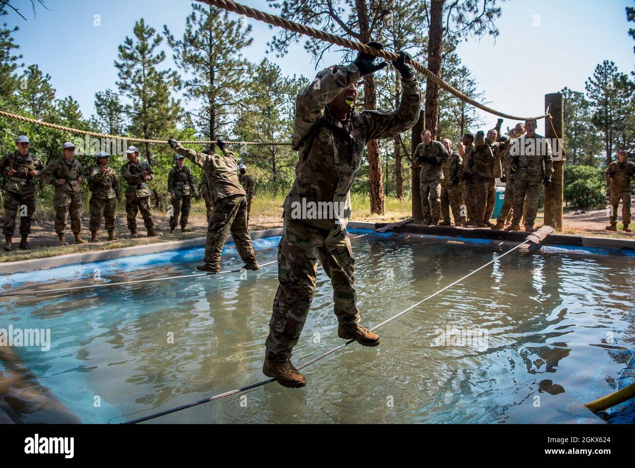 U.S. AIR FORCE ACADEMY, Colo. – Basic cadets from the Class of 2025 complete the obstacle course at the U.S. Air Force Academy's Jacks Valley in Colorado Springs, Colo., on July 15, 2021. Basic Cadet Training (BCT) is a six-week indoctrination program to guide the transformation of new cadets from being civilians to military academy cadets prepared to enter a four-year officer commissioning program. Stock Photo