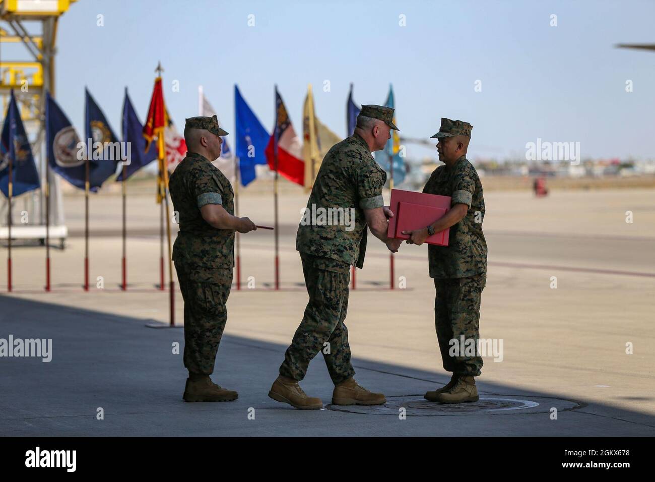 U.S. Marine Corps Sgt. Maj. Larry Buenafe receives awards from Col. Bryon Sullivan during a change of command ceremony on Marine Corps Air Station Yuma, Ariz., June 15, 2021. Sgt. Maj. Buenafe was relieved of his duty as Marine Operational Test and Evaluation Squadron 1 sergeant major by Sgt. Maj. Frank Gratacos. Stock Photo