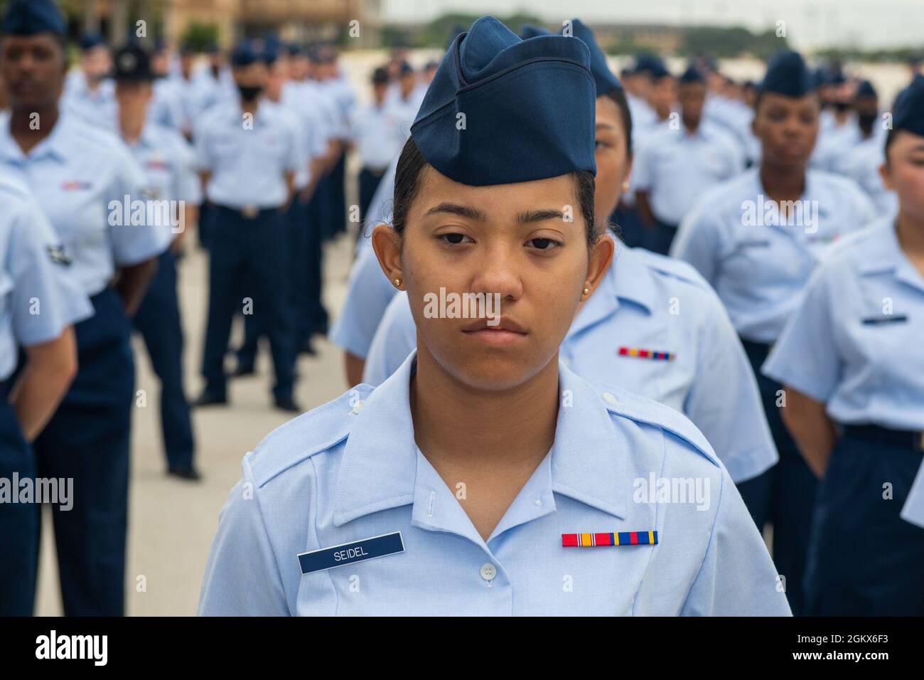 U.S. Air Force Airmen and Space Force Guardians basic military graduation  and coining ceremony is held July 15, 2021, for the 433rd Training Squadron  at the Pfingston Reception Center on Joint Base