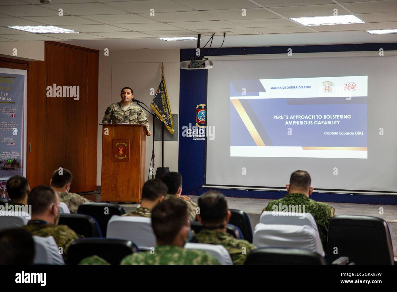 Capitan de Navio Eduardo Raul Diaz Leon, naval commander of the Peruvian Amphibious Brigade, provides an opening brief and discusses doctrine, organization, units and platforms, and instruction and training on behalf of the Peruvian amphibious brigade during a multinational amphibious planning conference hosted by the Peruvian Marine Corps in Ancon, Peru, July 16, 2021. Amphibious partners from Peru, Argentina, Brazil, Chile, Colombia, Ecuador, Mexico, Uruguay, and the United States gathered at the newly established International Amphibious Training Center to share experiences, tactics, and le Stock Photo