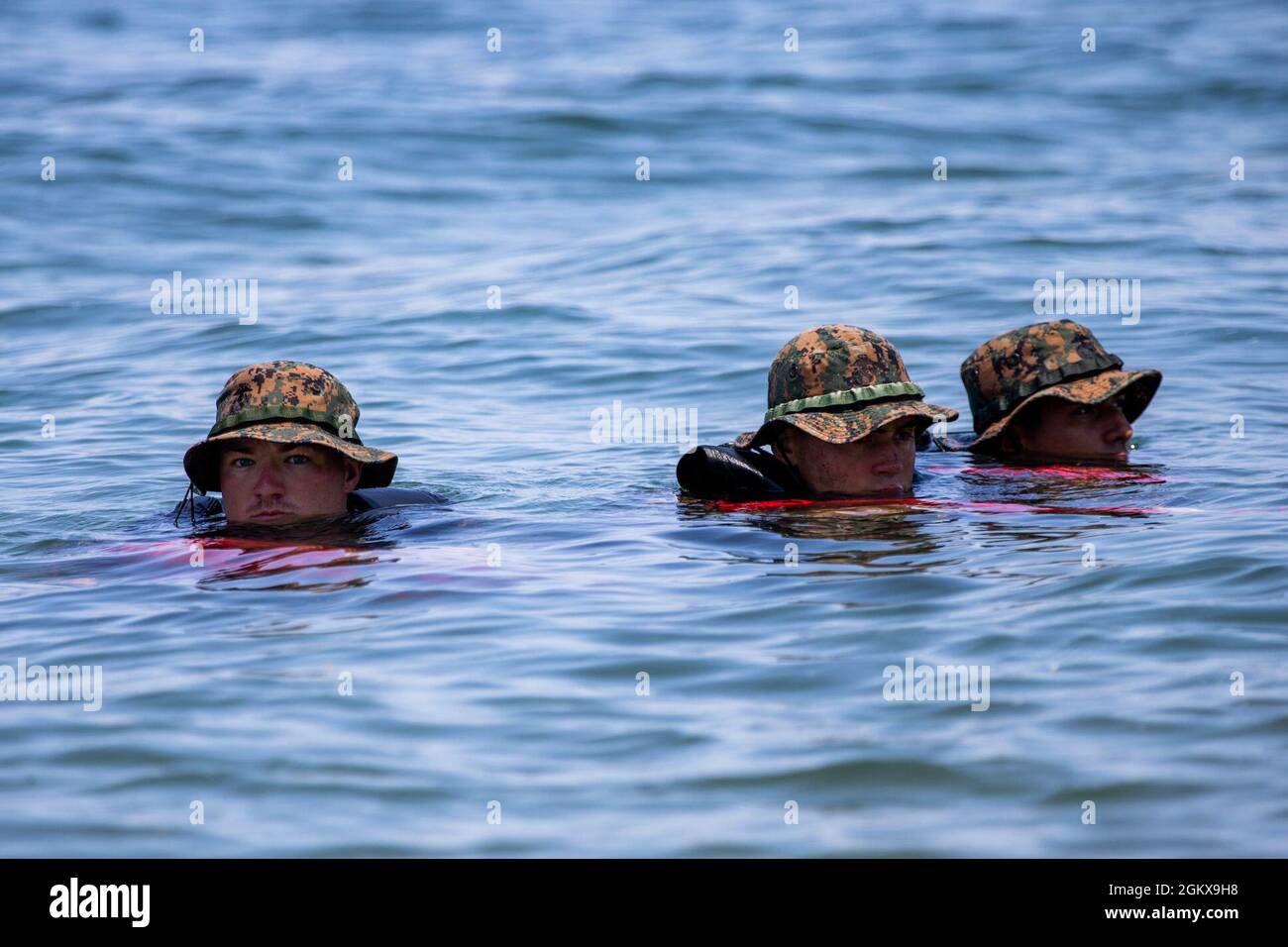 U.S. Marines with Co. C, 1st Battalion, 5th Marine Regiment, 1st Marine Division, practice rescue drills and raid tactics during a Scout Swimmer Course on Naval Amphibious Base Coronado, California, July 16, 2021. The Marines learned the skills necessary to plan and execute swimmer reconnaissance for a small boat raid company in preparation for deployment. Stock Photo